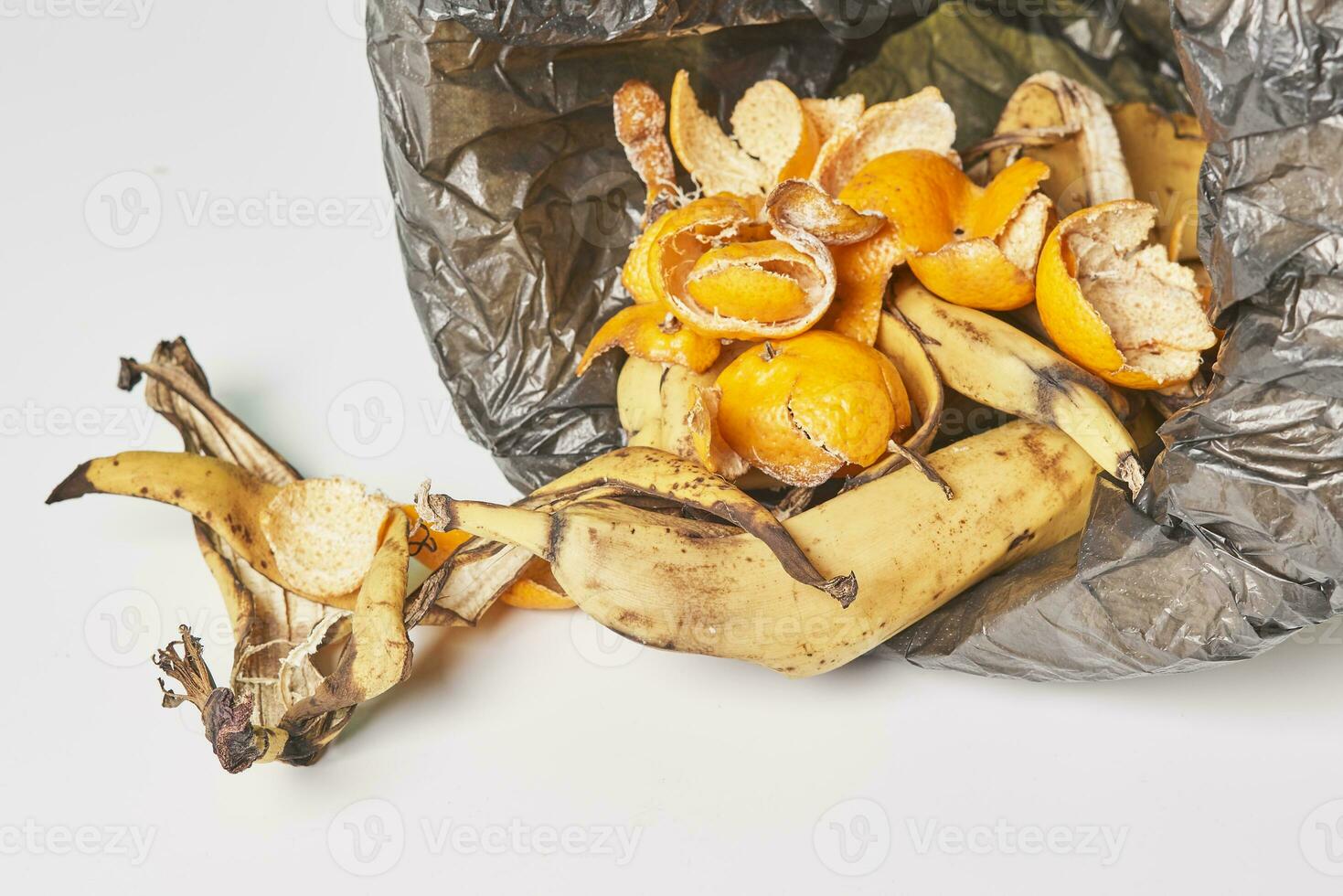 Banana peels in trash can photo