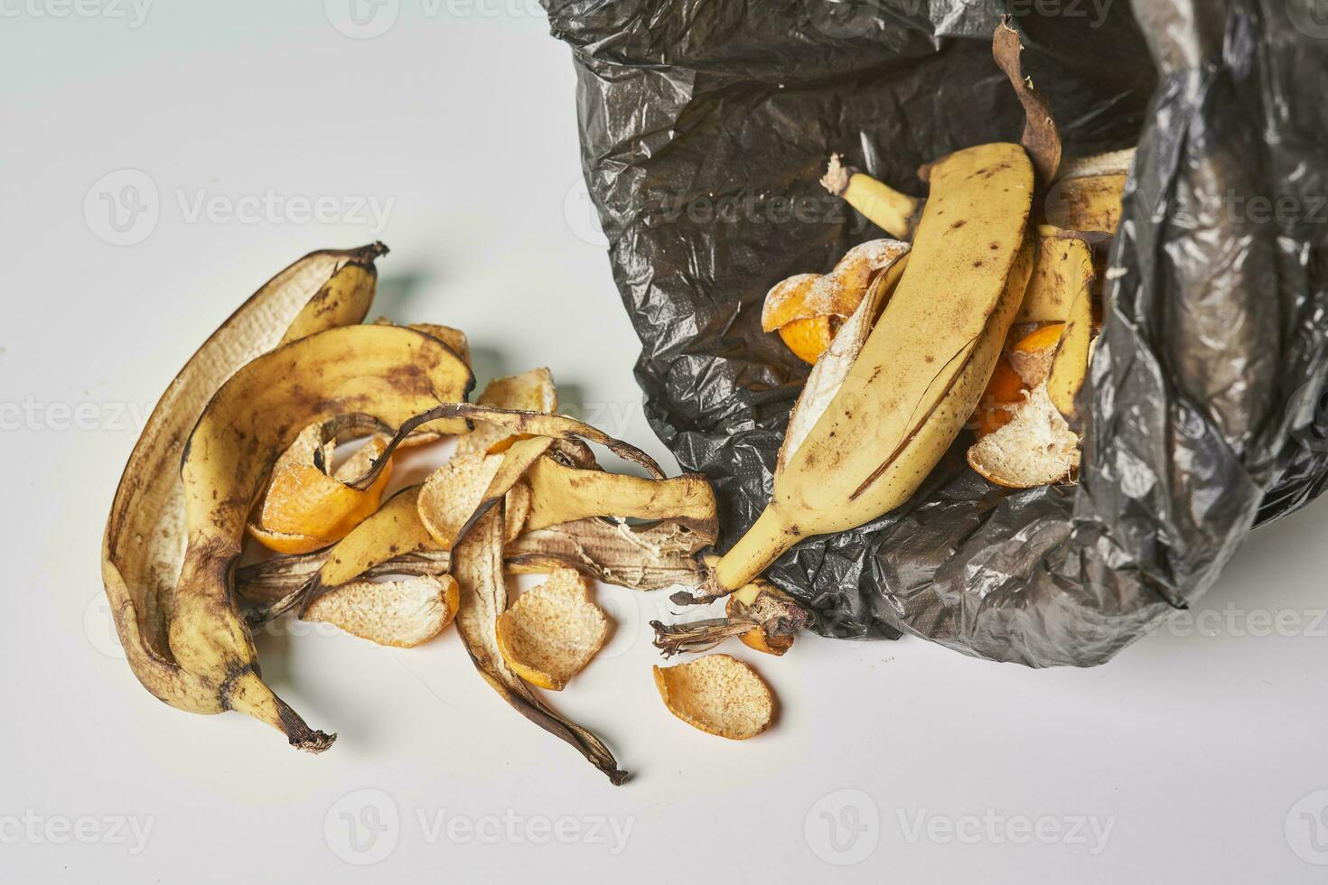 Banana peels in trash can photo