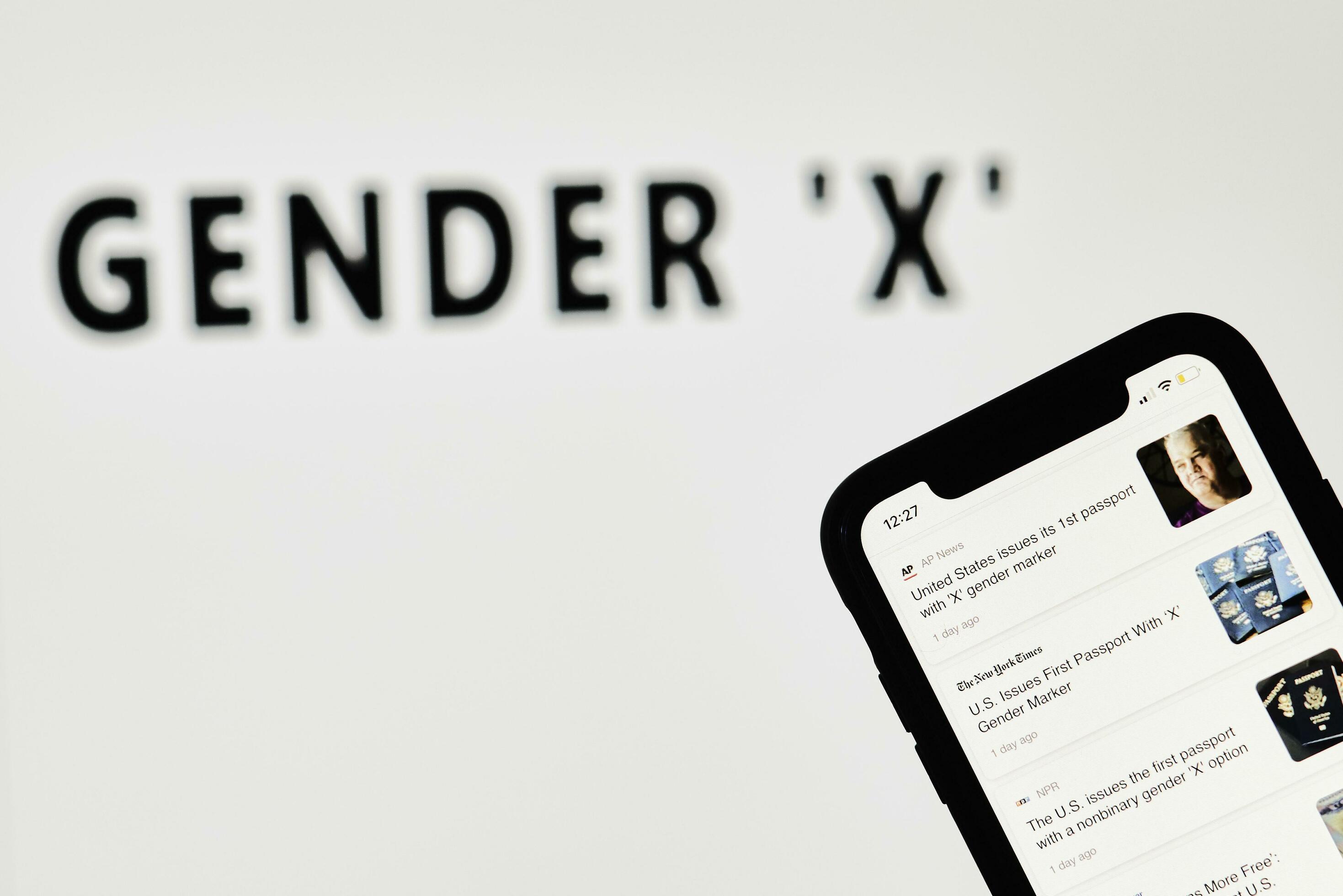 Person browsing news about US new passports with X gender marker