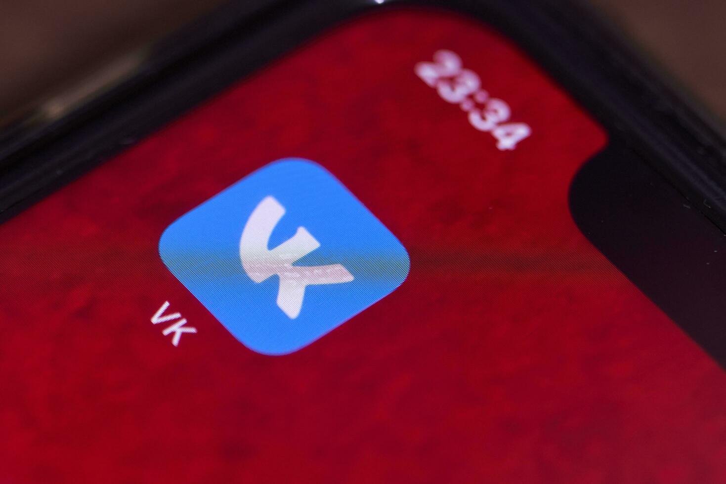 Vk or vkontakte mobile application on smartphone screen photo