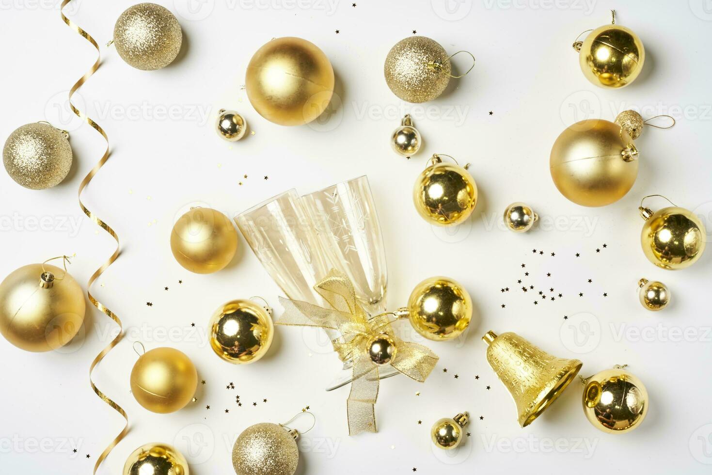 Christmas background with Golden colored decorations on white photo