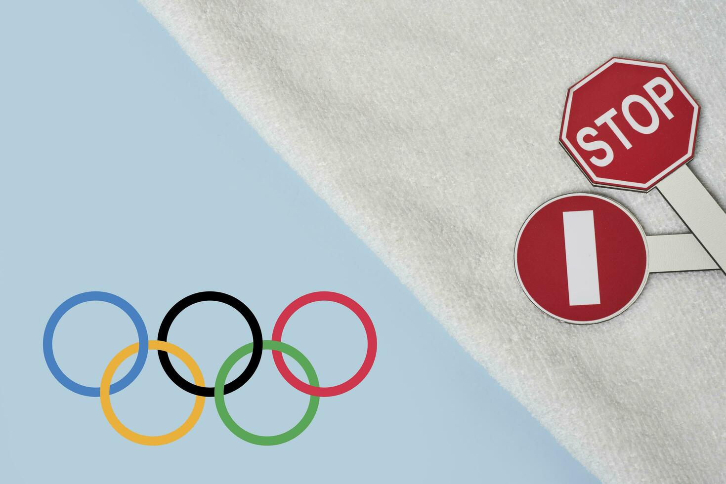 Boycotting Olympic Games - Restricting traffic sings and Olympic flag on towel photo