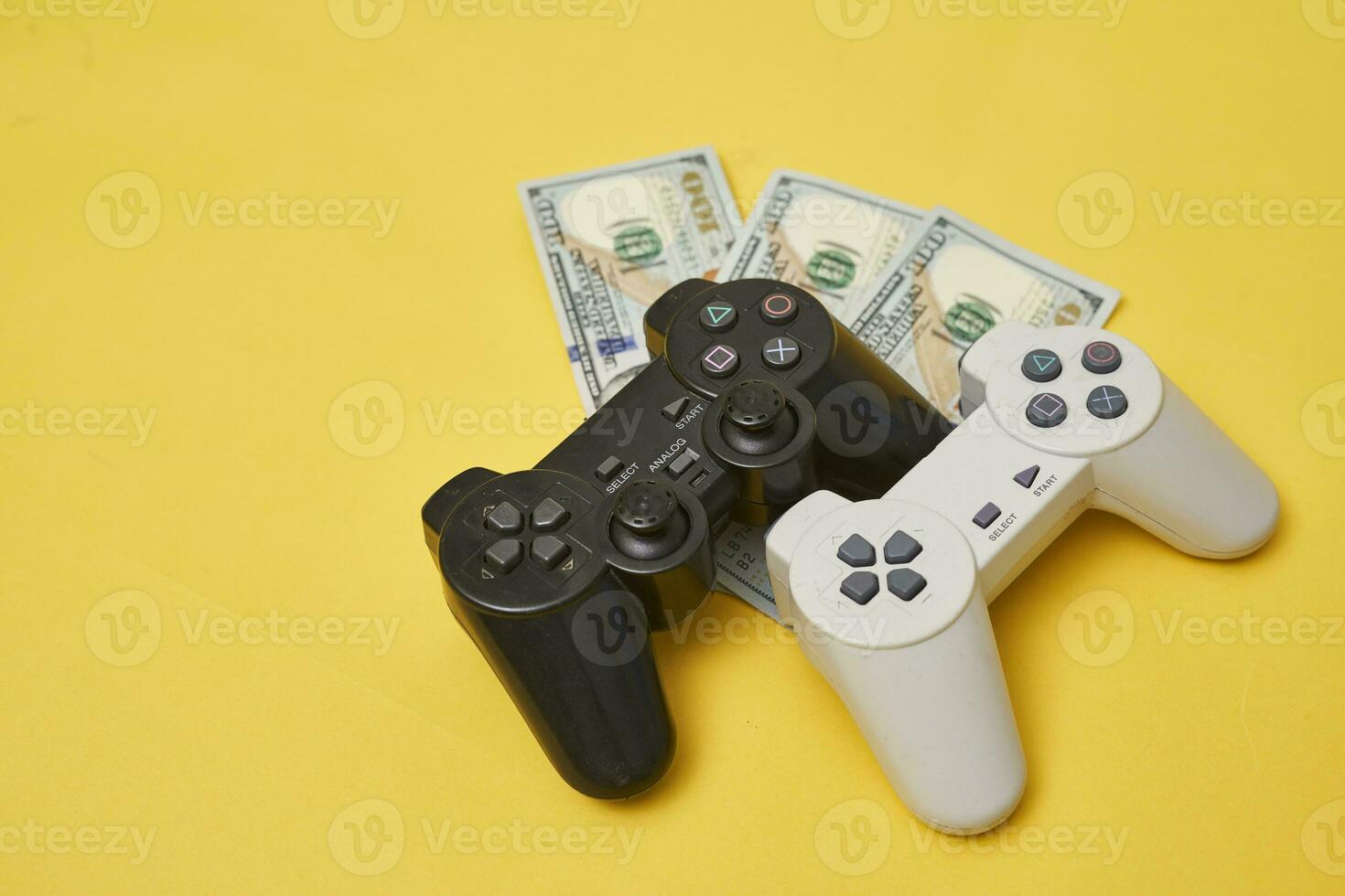 Game joystick and pile of money photo