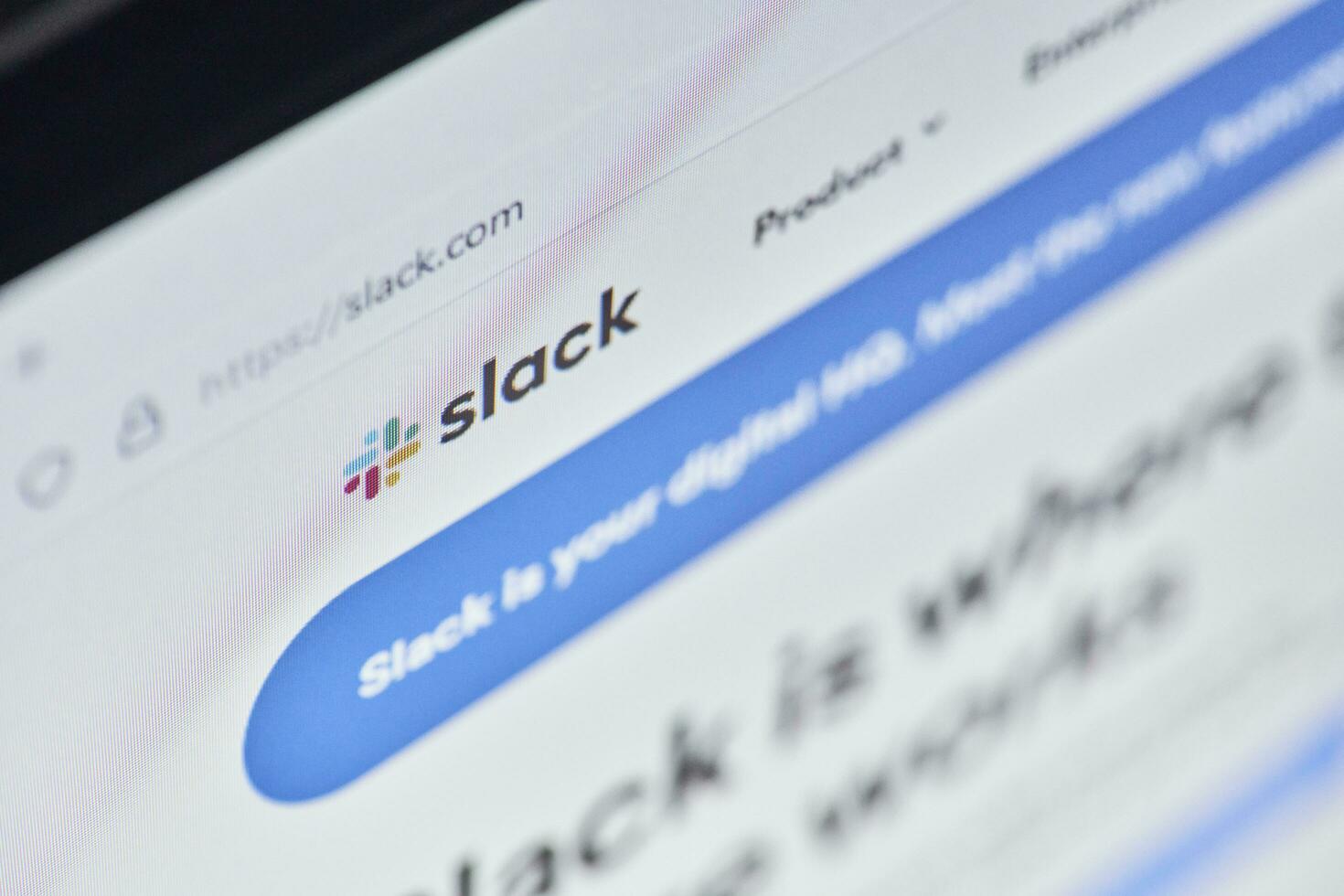 Slack web page on computer monitor photo