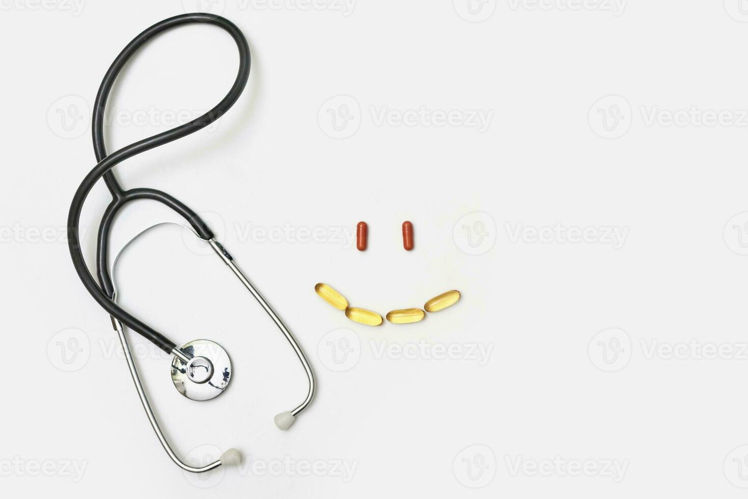 Stethoscope and smile sign made of pills photo