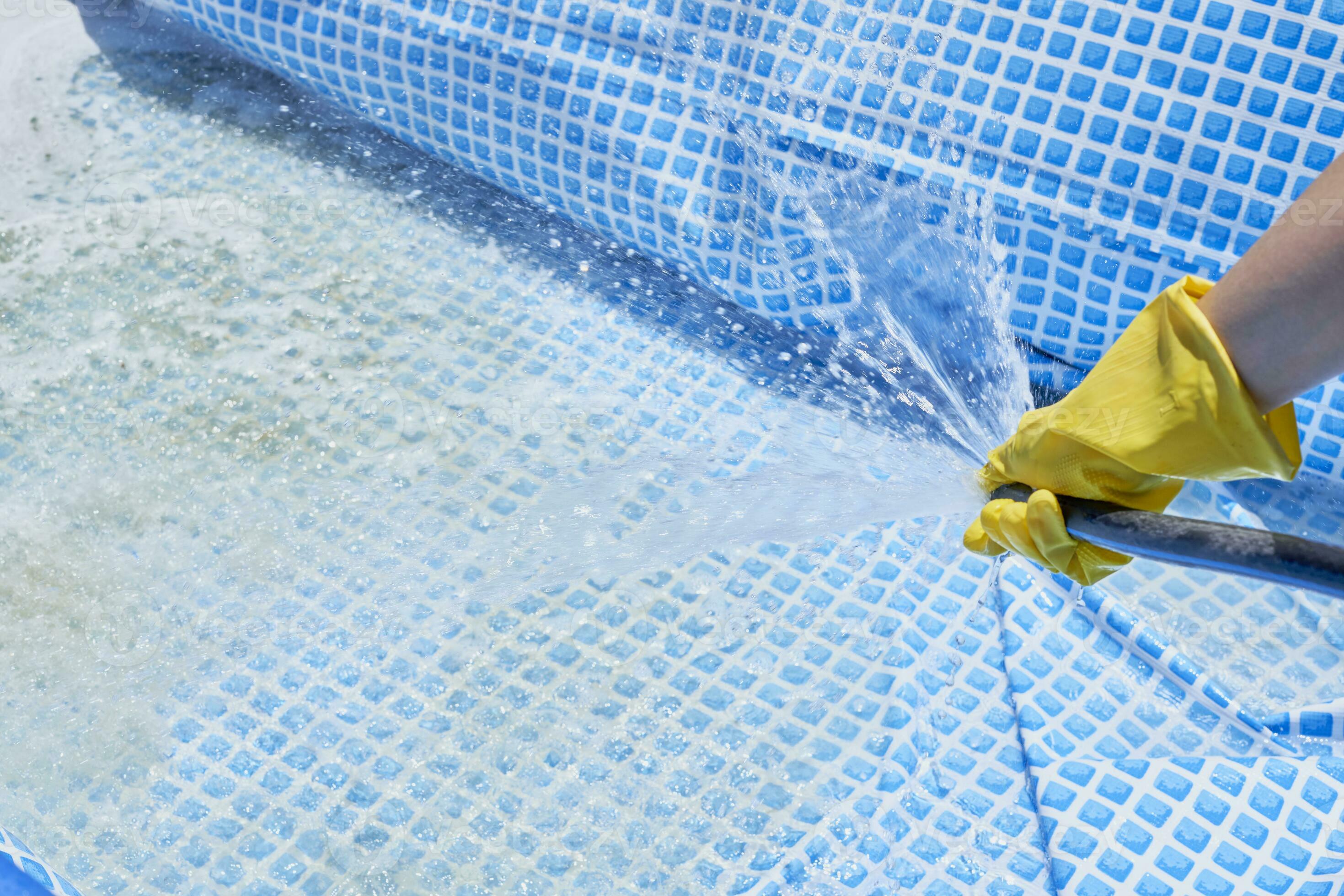 Cleaning home inflatable swimming pool 31176715 Stock Photo at Vecteezy
