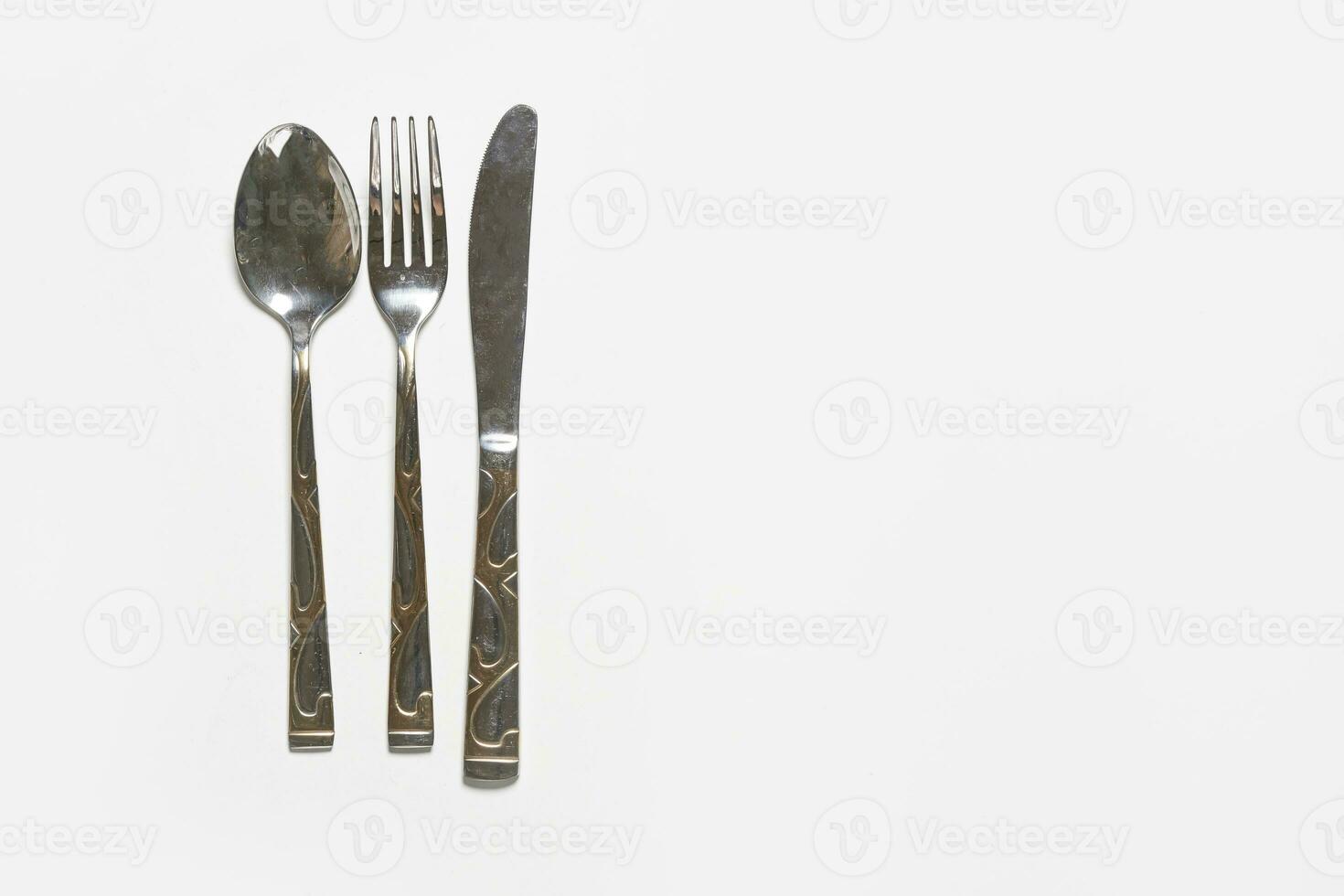 Restaurant eating items - Fork, spoon and knife photo