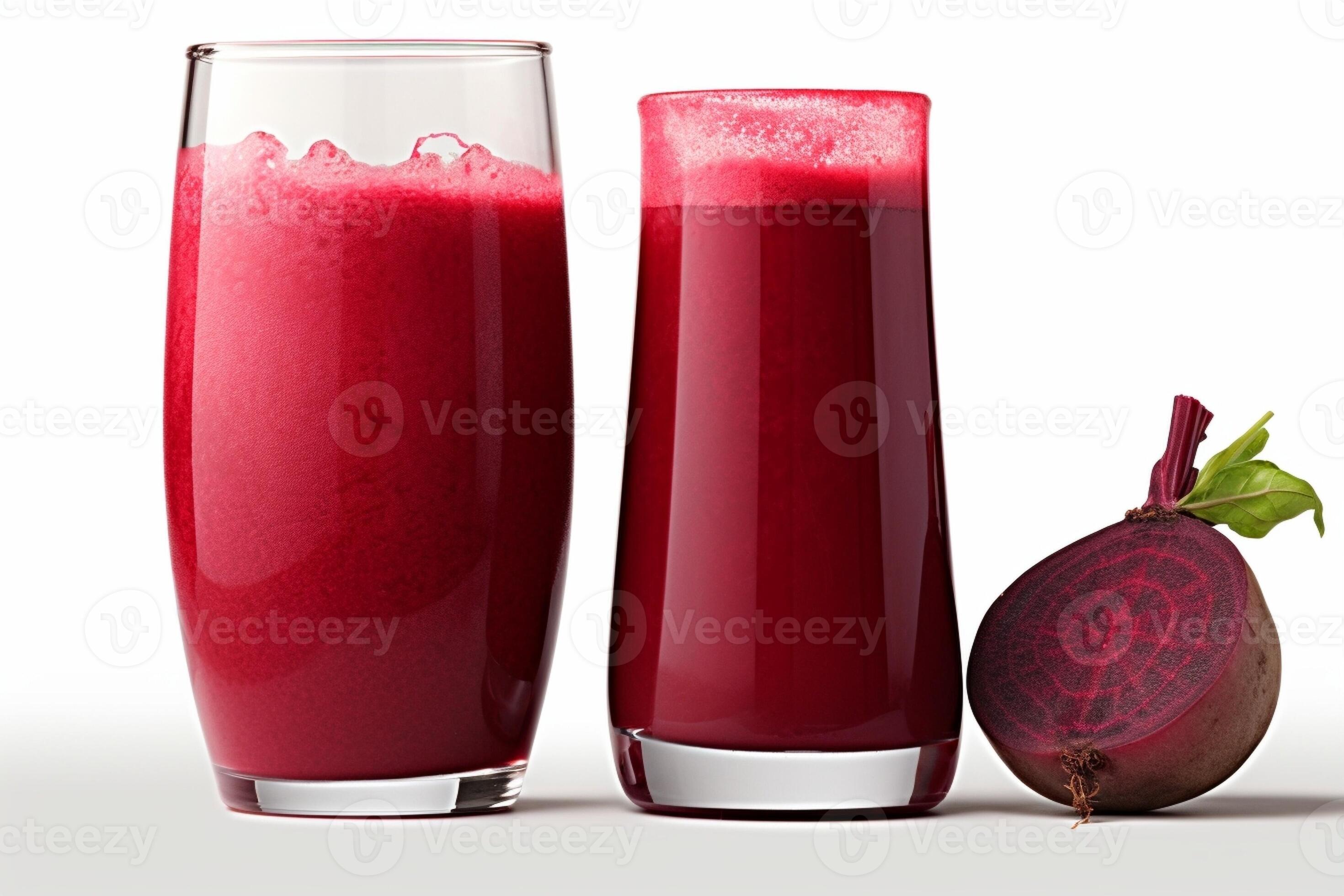 Glass of fresh beet juice with beet slice on itIsolated on white