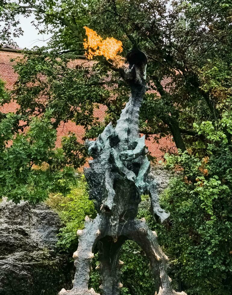 Krakow, Poland - 08.06.2023 The Dragon of Wawel Hill next to the Wawel Castle in Krakow, Poland. photo