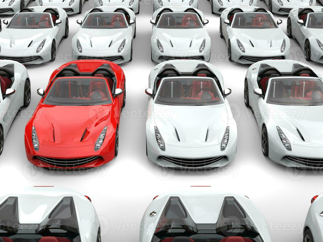 Fiery red sports car stands out from the crowd of white sports cars photo