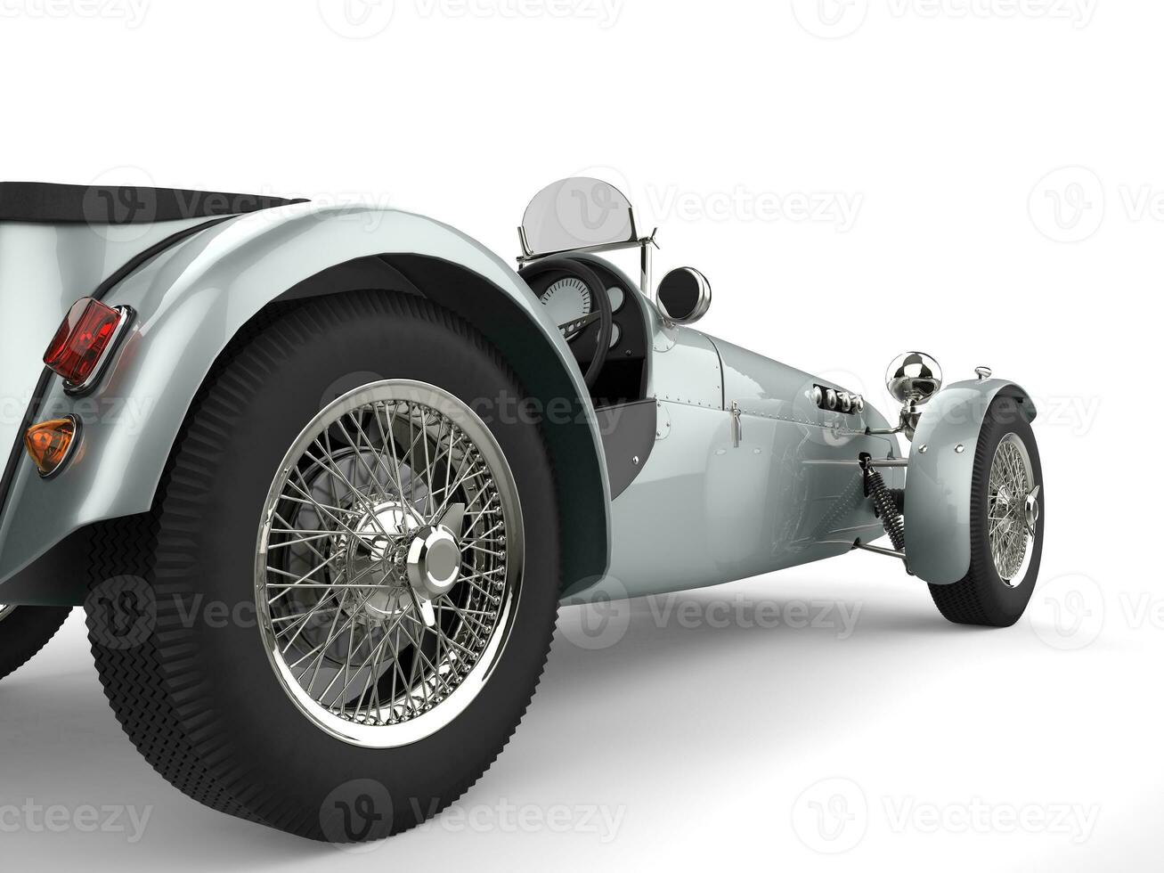 Vintage metallic silver open wheel sport racing car - rear wheel closeup shot photo