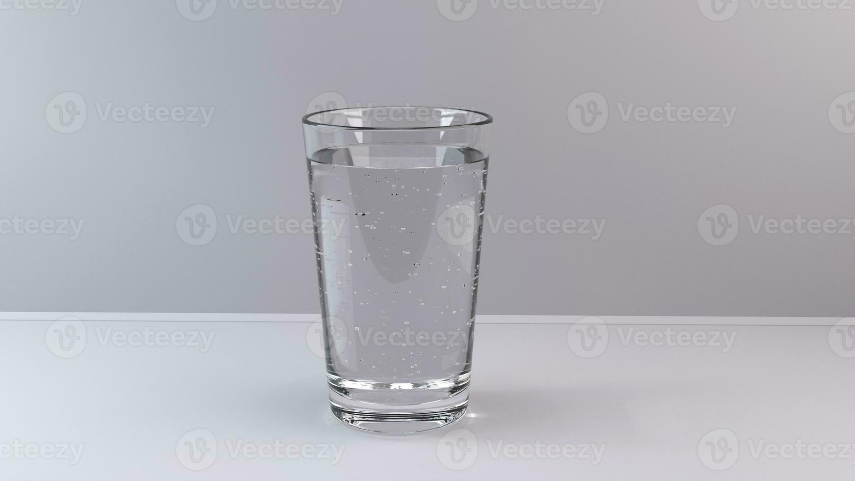 Glass of clear water with bubbles on light background photo