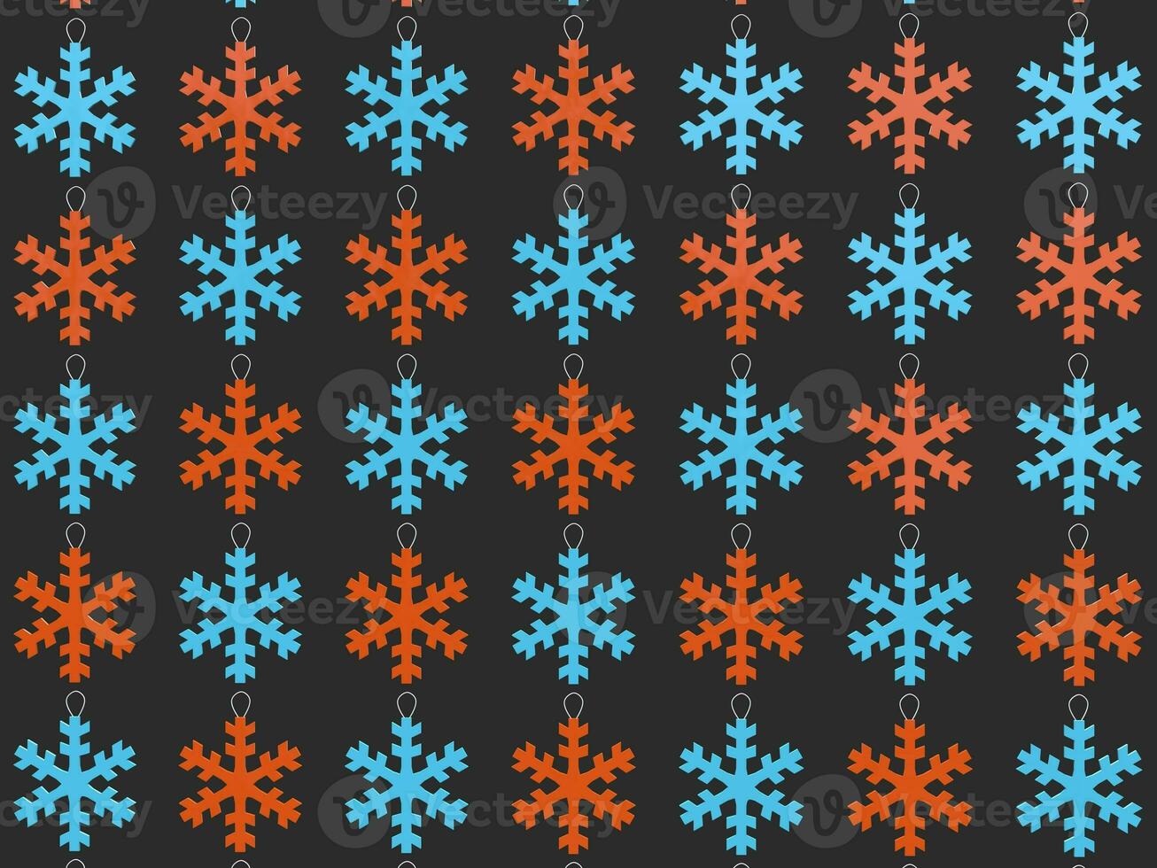 Red and blue snowflake Christmas tree decorations - dark gray background photo