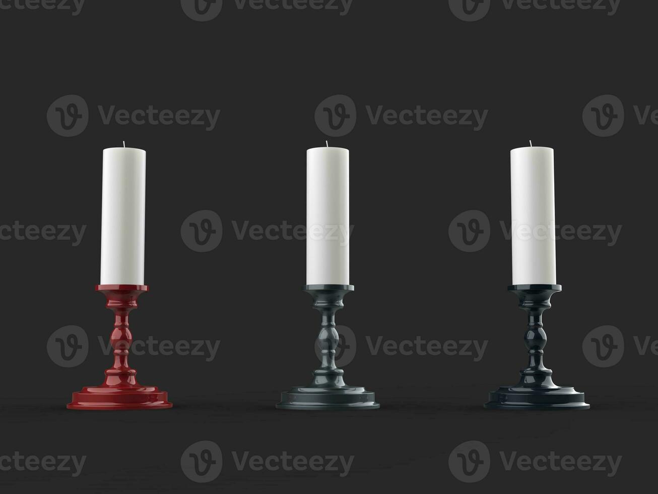 Three white wax candles on shiny metallic red, grey and black candleholders photo