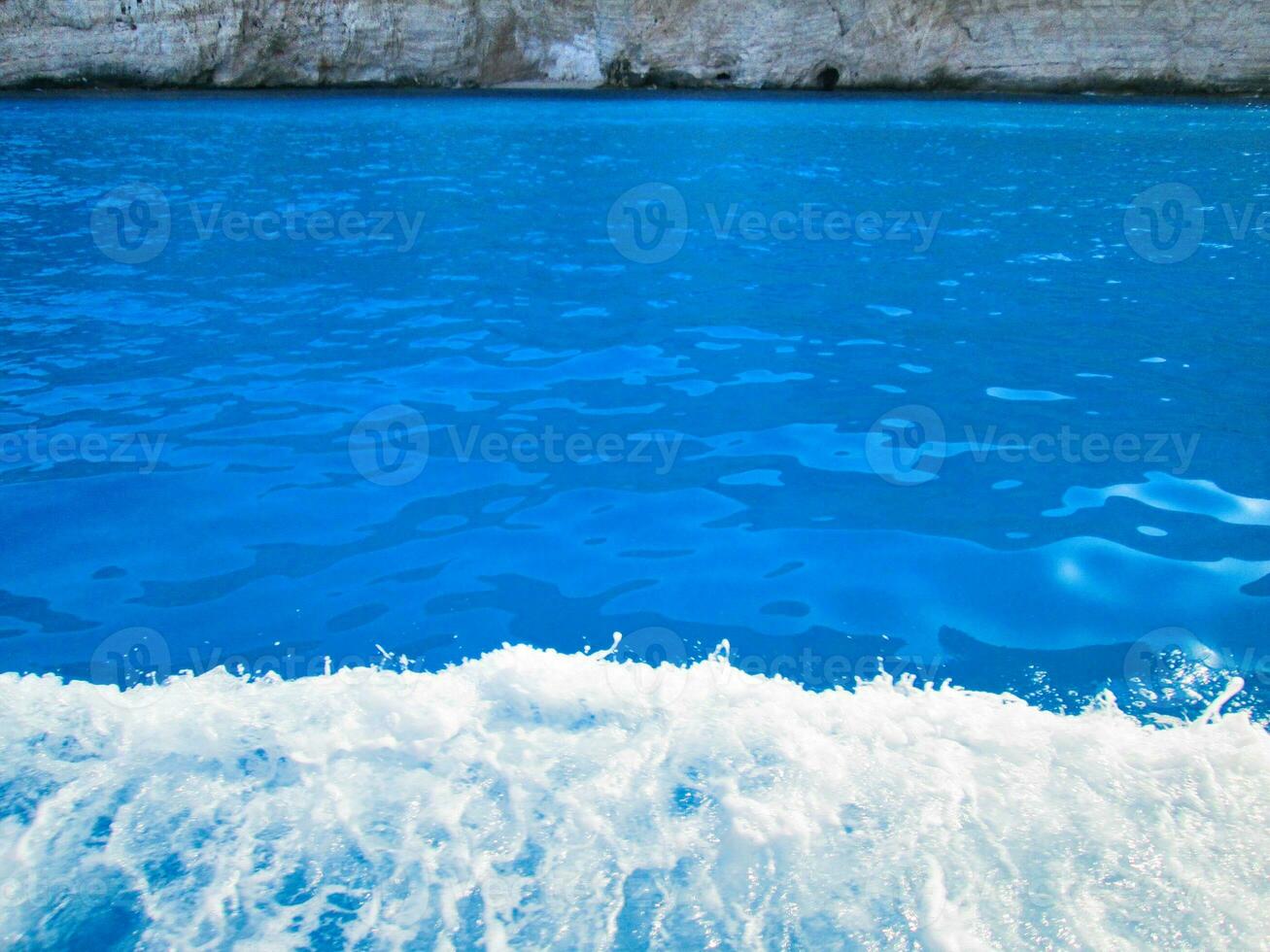 Small waves on bright blue water photo