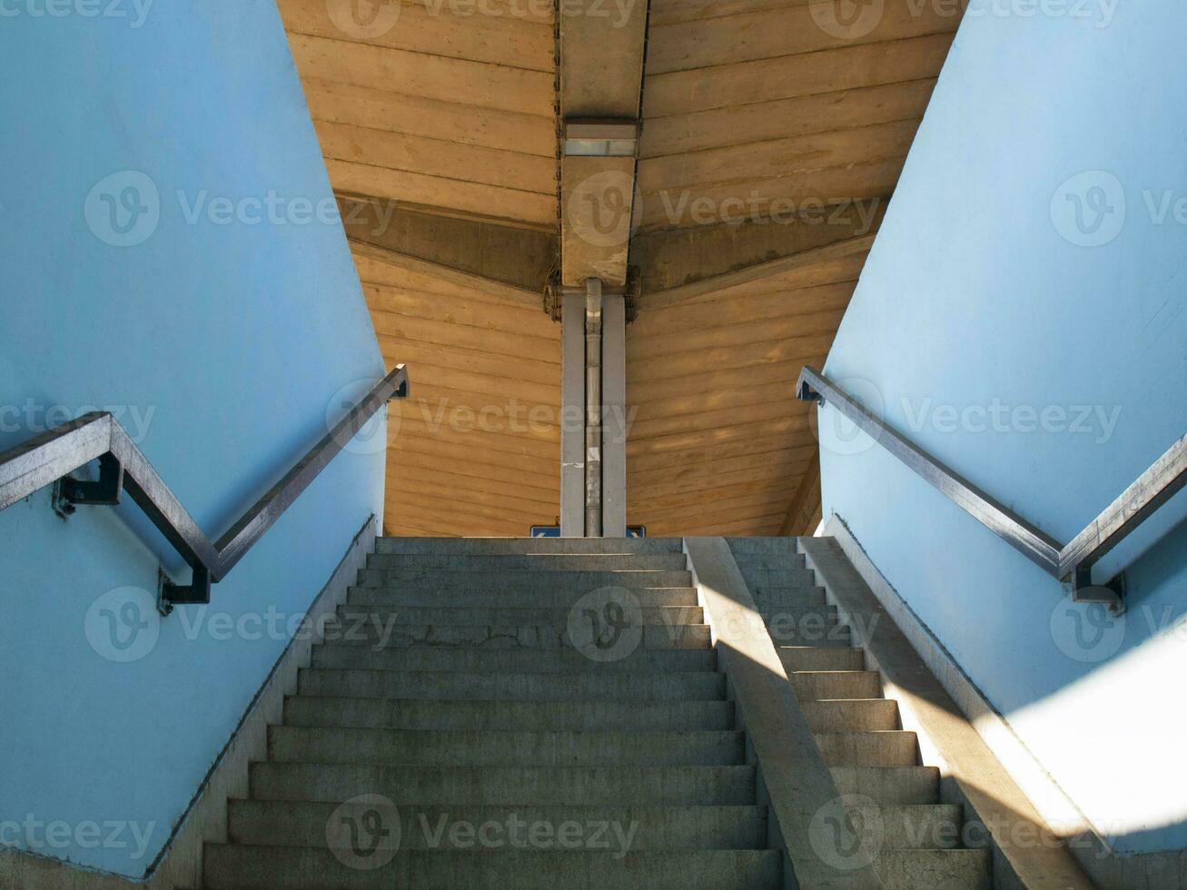 Blue stairway with orange roof photo