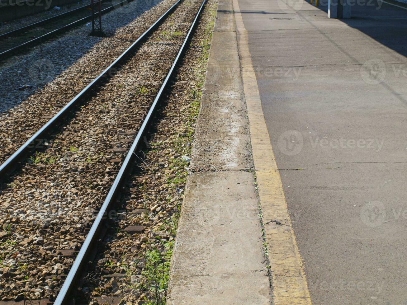 Train rails and concrete photo