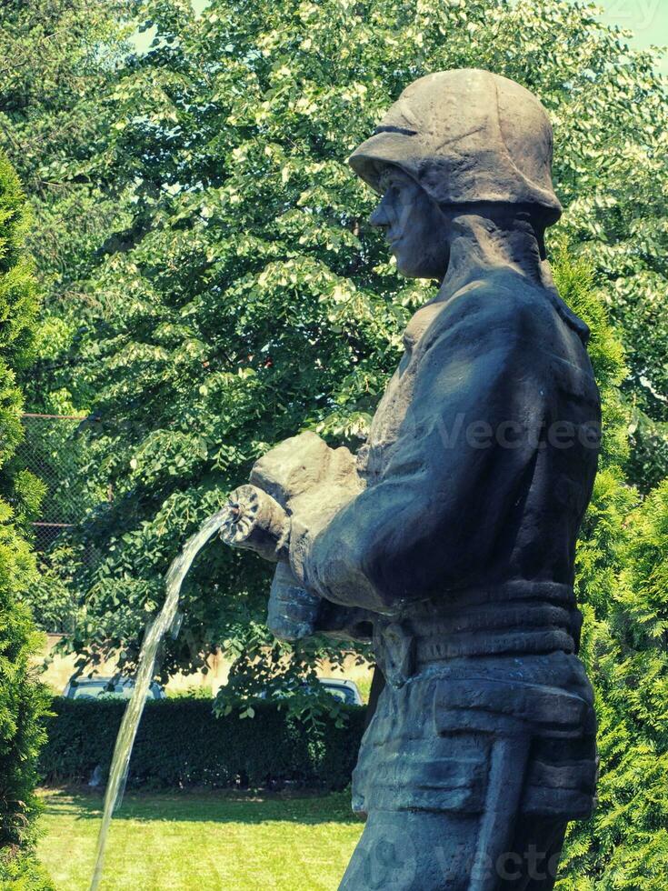 Bronze fireman water fountain statue photo