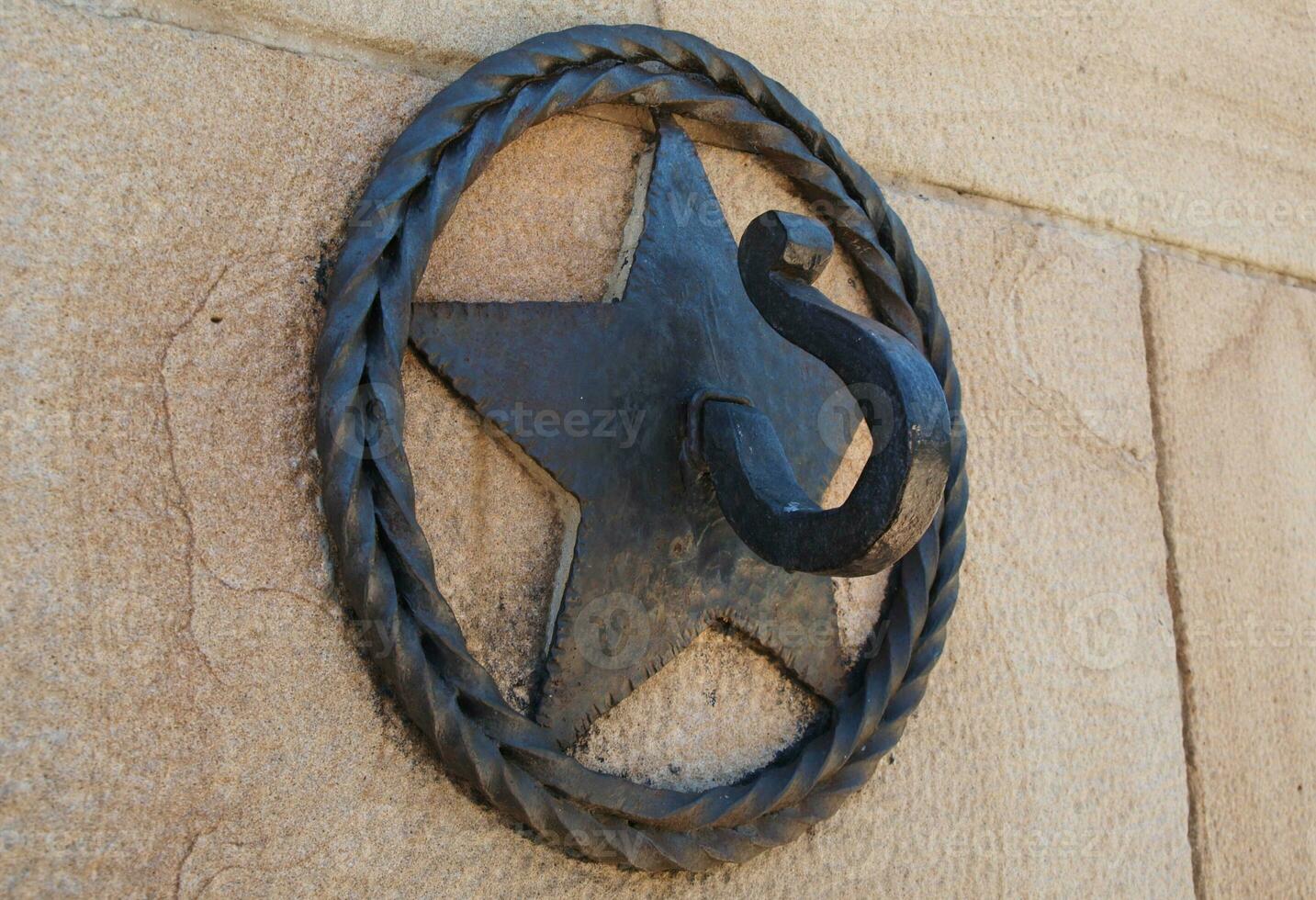 Star cast iron ornamental hook - closeup shot photo