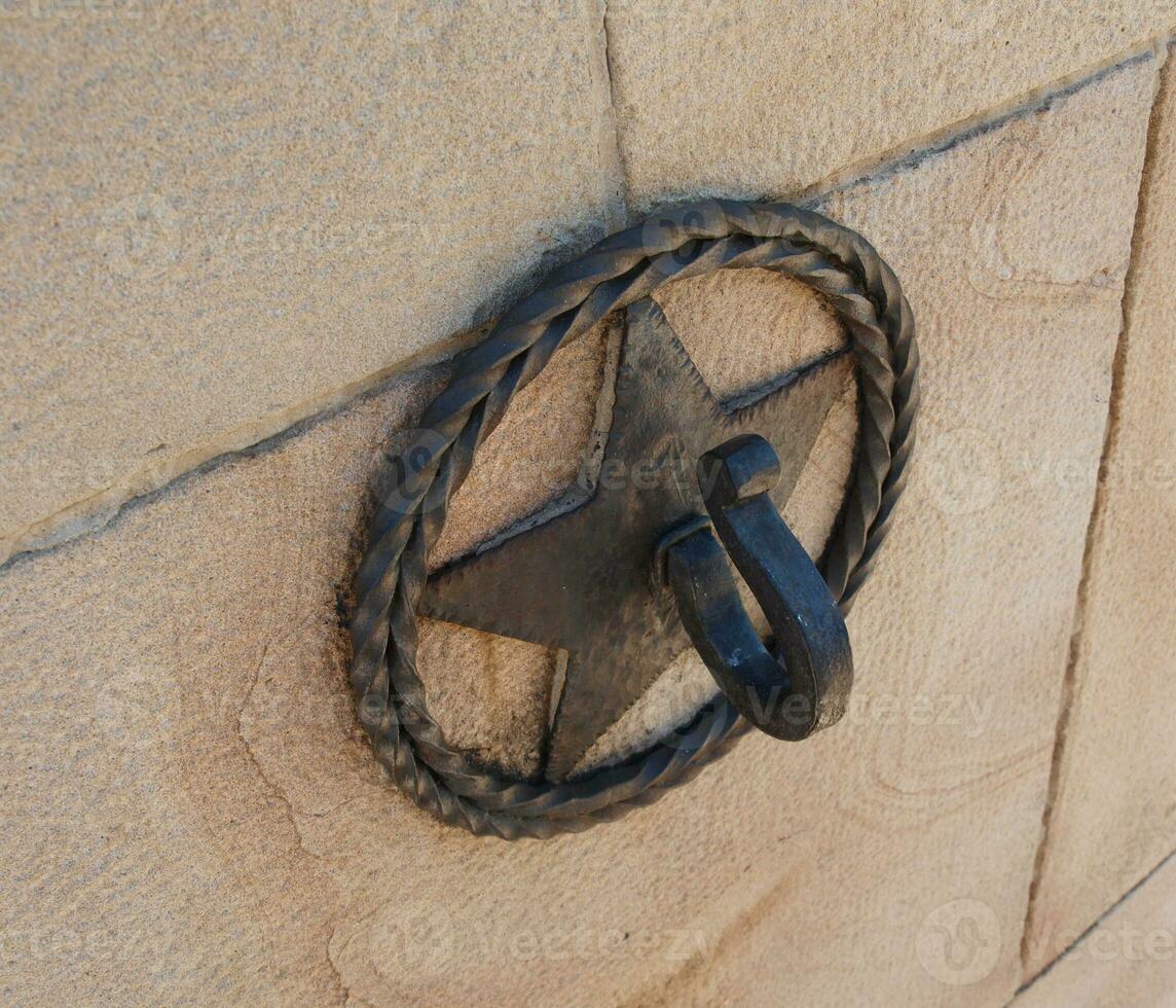 Star cast iron ornamental hook - top angle view photo