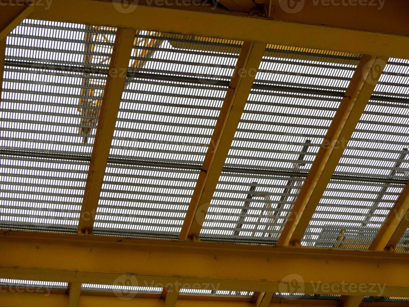 Yellow grid construction floor - shot from below photo