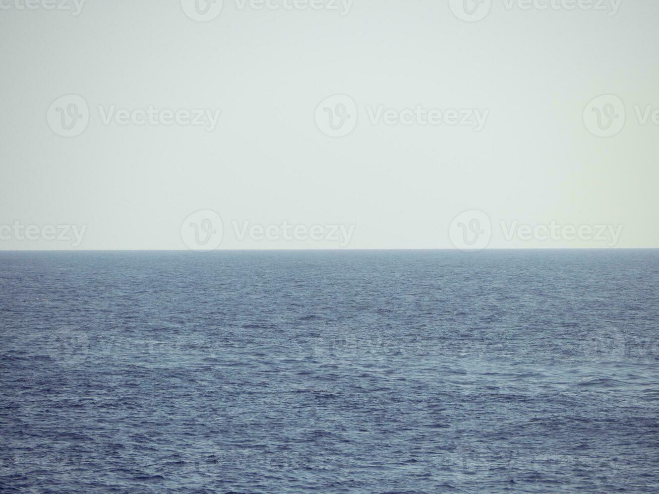 Calm foggy ocean - nothing on the horizon photo