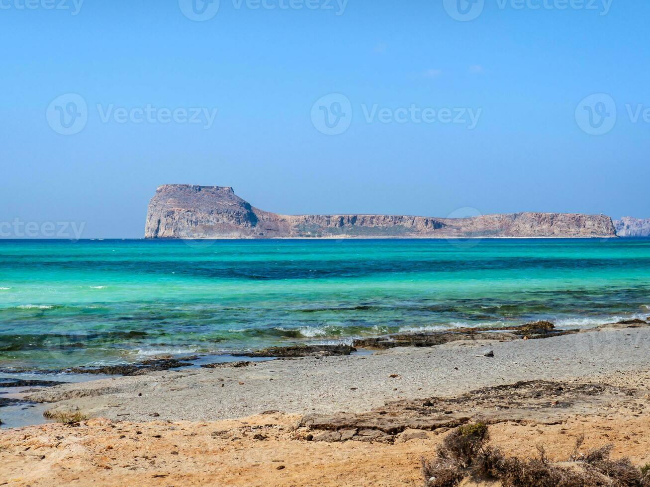 Empty beach and beautiful blue sea on the Balos beach overlooking the Gramvousa island photo