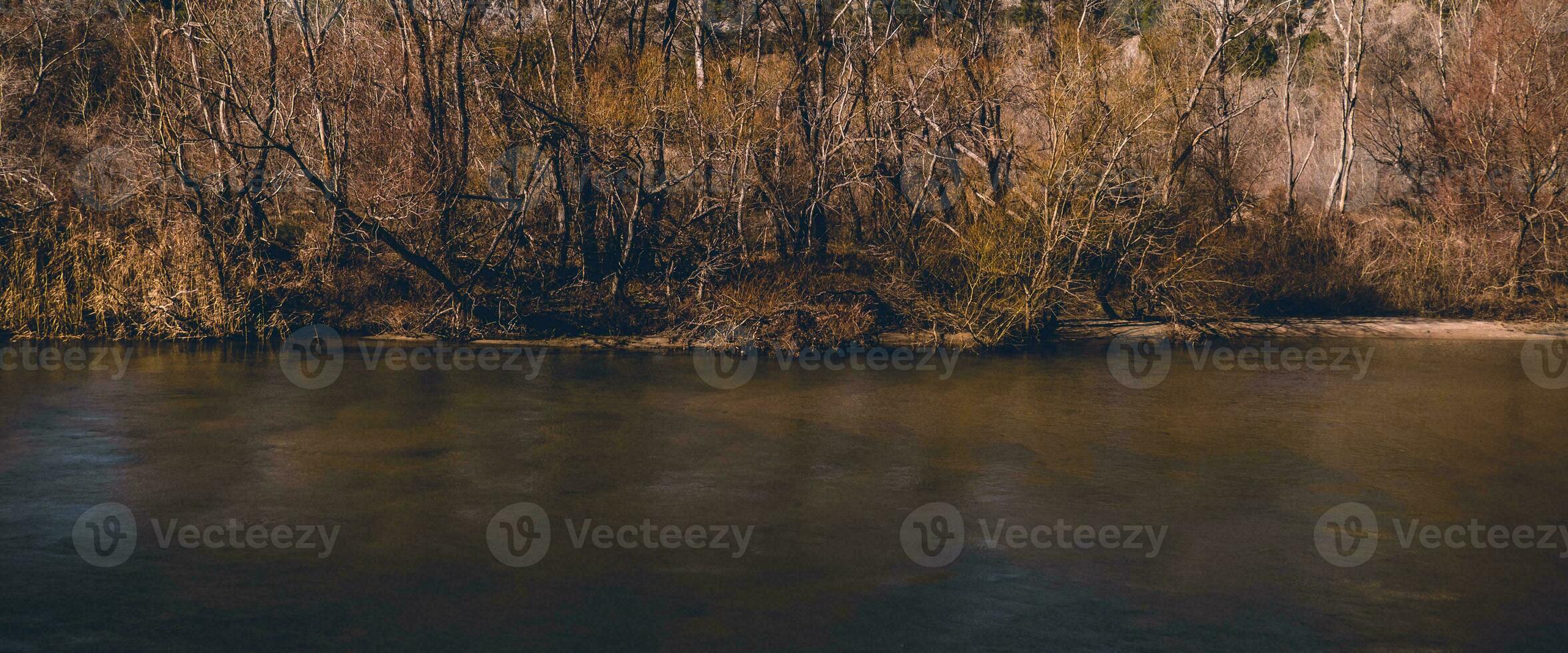 Dark river in late autumn photo