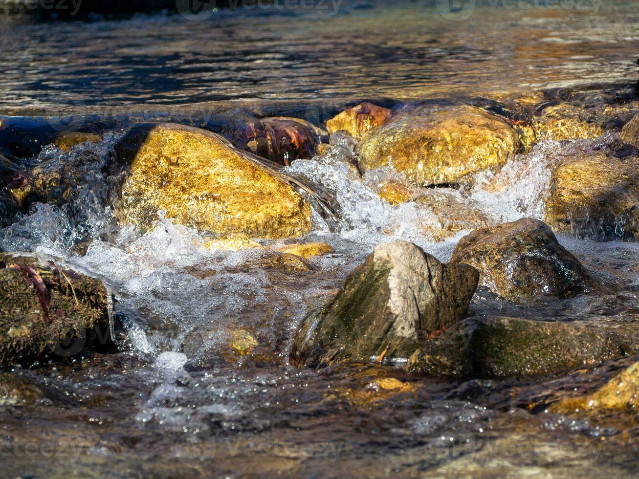 Stones in the cold mountain creek photo