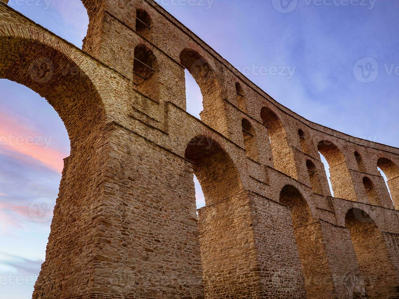 Stunning ancient Roman aqueduct in center of Kavala city - Greece photo