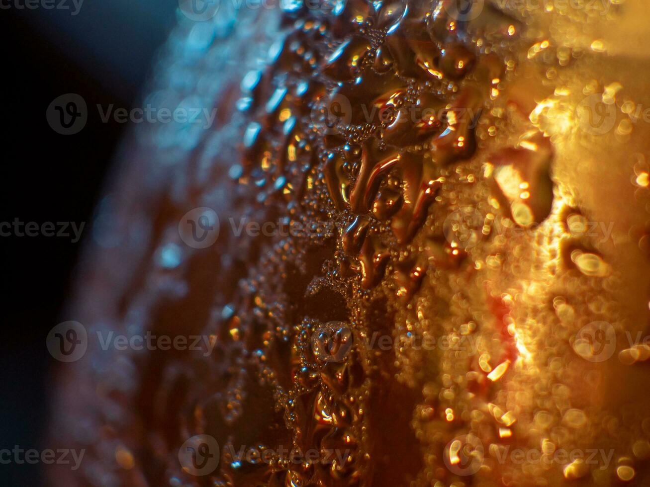 Drops of condensation on a bottle - closeup shot photo