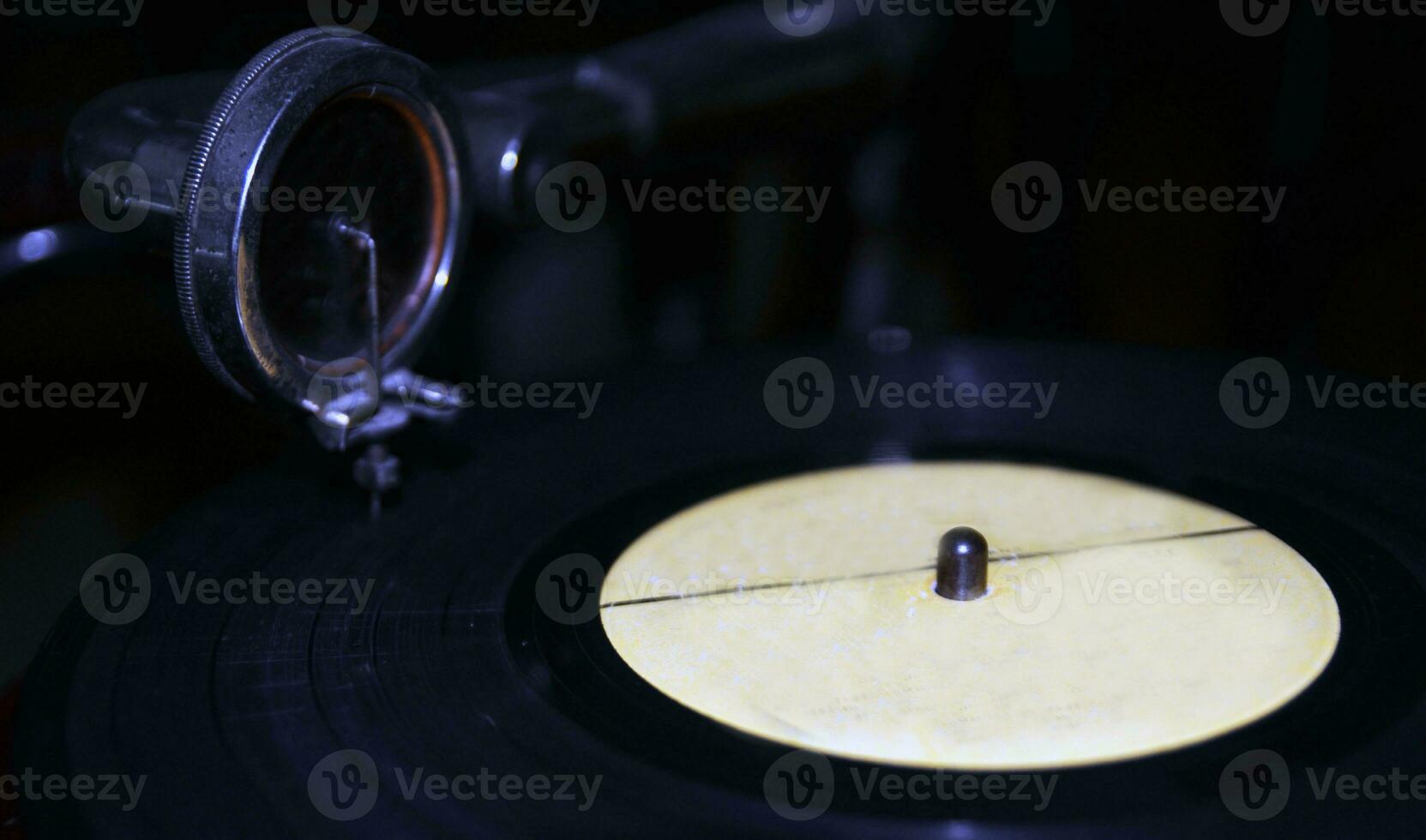 Black vinyl disc on a gramophone background photo