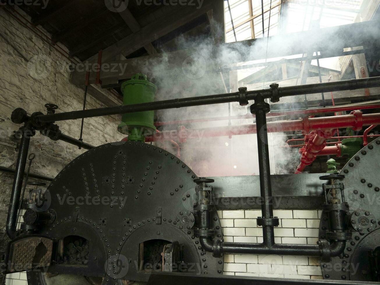 Industrial pipes at the power plant background, steam engines, ovens and boilers, factory without people photo