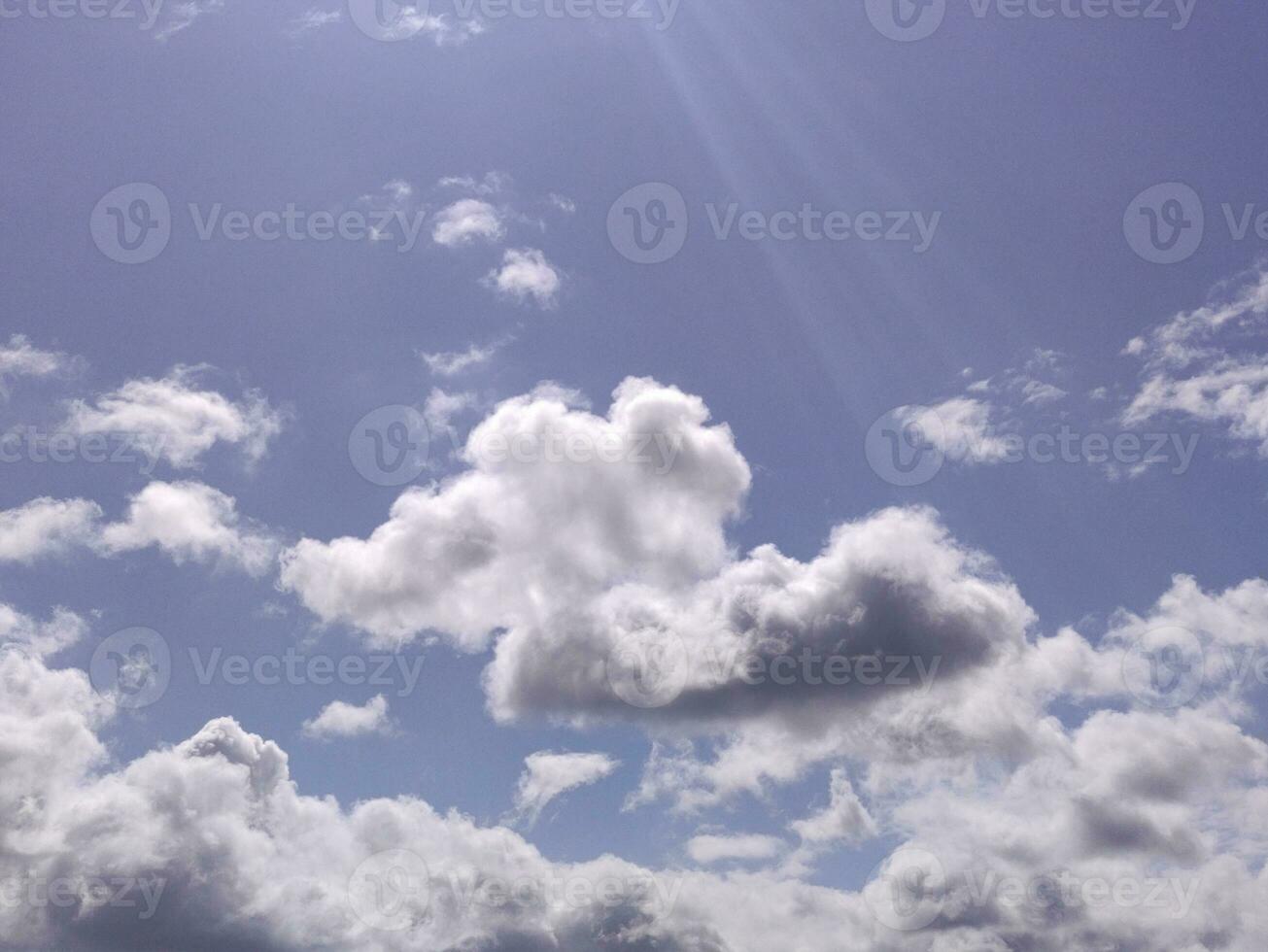 White clouds over blue sky background. Fluffy cumulus cloudscape photo