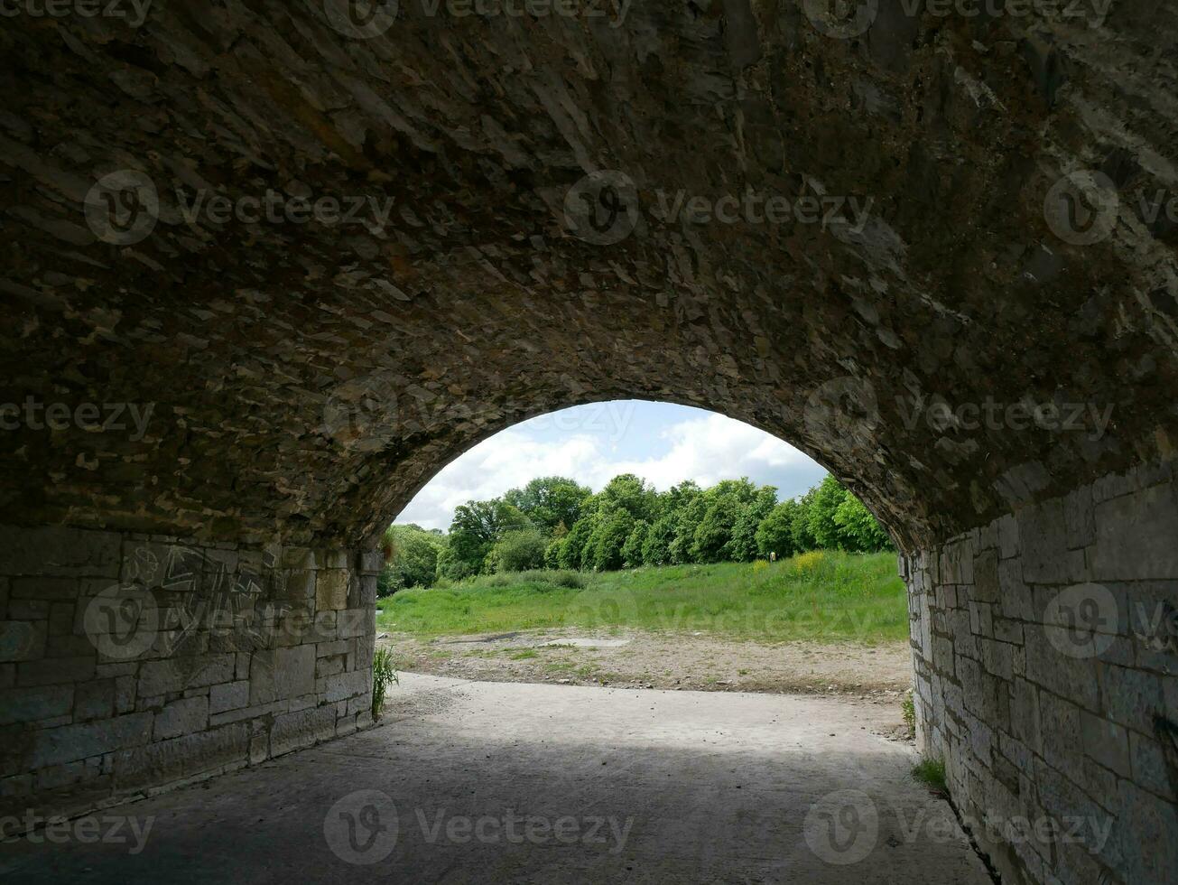 Old stone bridge in Ireland, ancient bridge made of stones and bricks photo