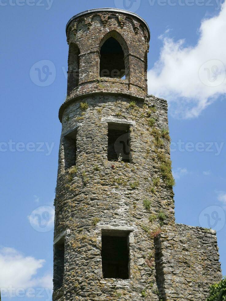 Old celtic castle tower over blue sky background, Blarney castle in Ireland, celtic fortress photo