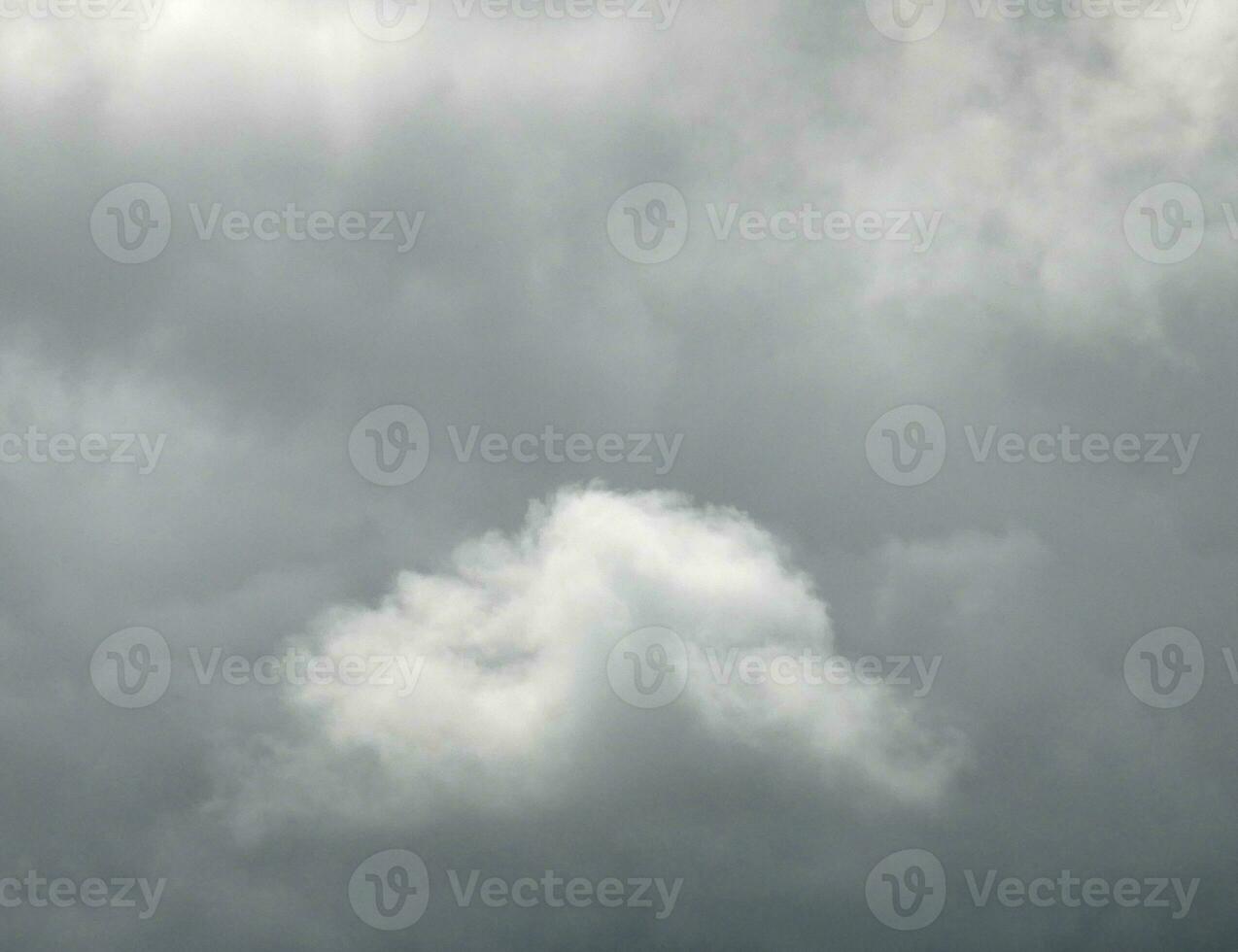 Stormy clouds background, grey smoke from fire photo