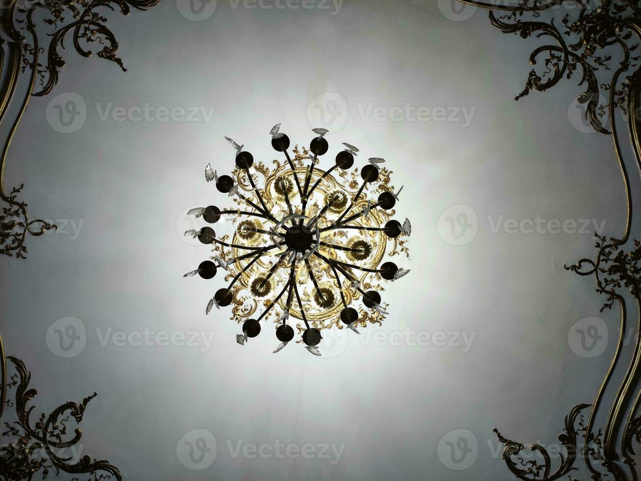 Under chandelier background, white ceiling with cracks and metal frame, theater vintage ceiling photo