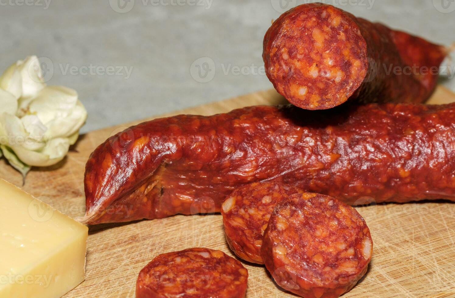 Tasty sausages isolated over solid background photo