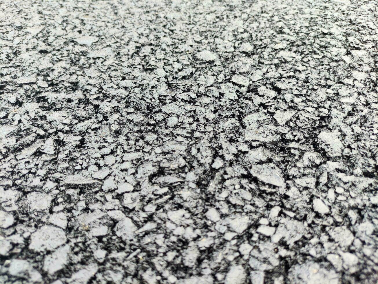 Asphalt background, sand and stones texture close view photo