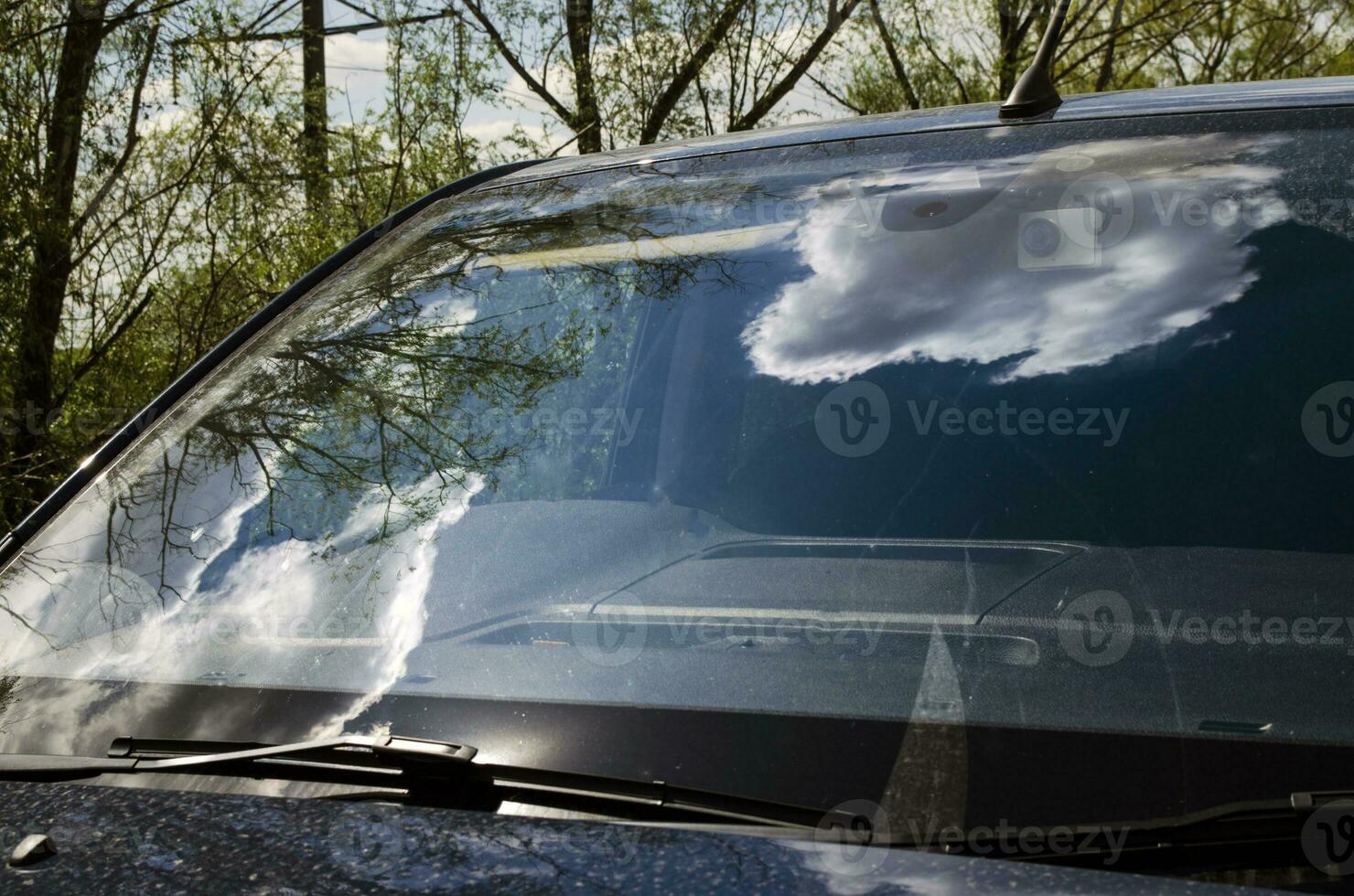 Clouds reflection on the car window photo