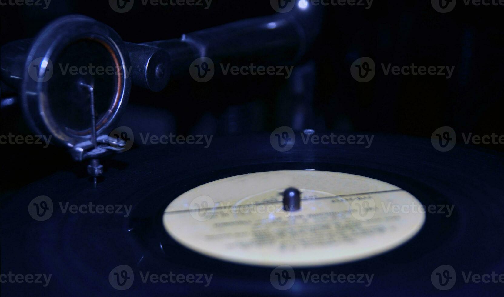 Black vinyl disc on a gramophone background photo