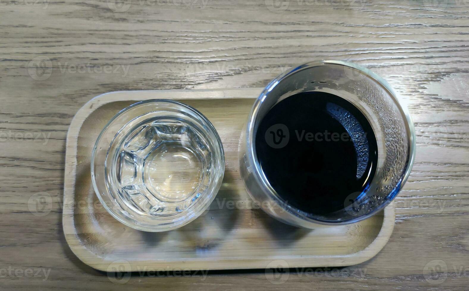 Coffee and water background, black coffee and a glass of water photo