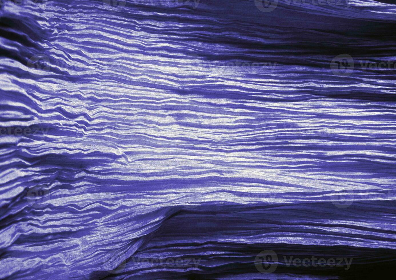 Deep blue glossy cloth texture background. Natural textile material photo, pattern cover photo