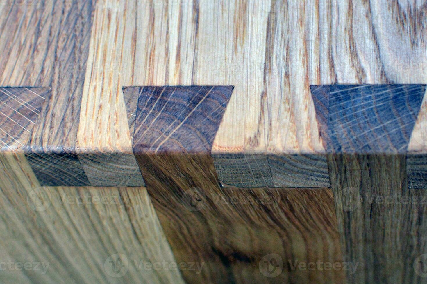 Wooden dinner table surface. Natural wood furniture close view photo