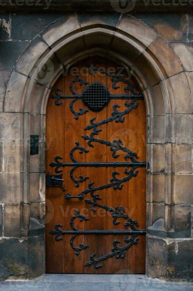 Ancient wooden door in the cathedral in Prague photo