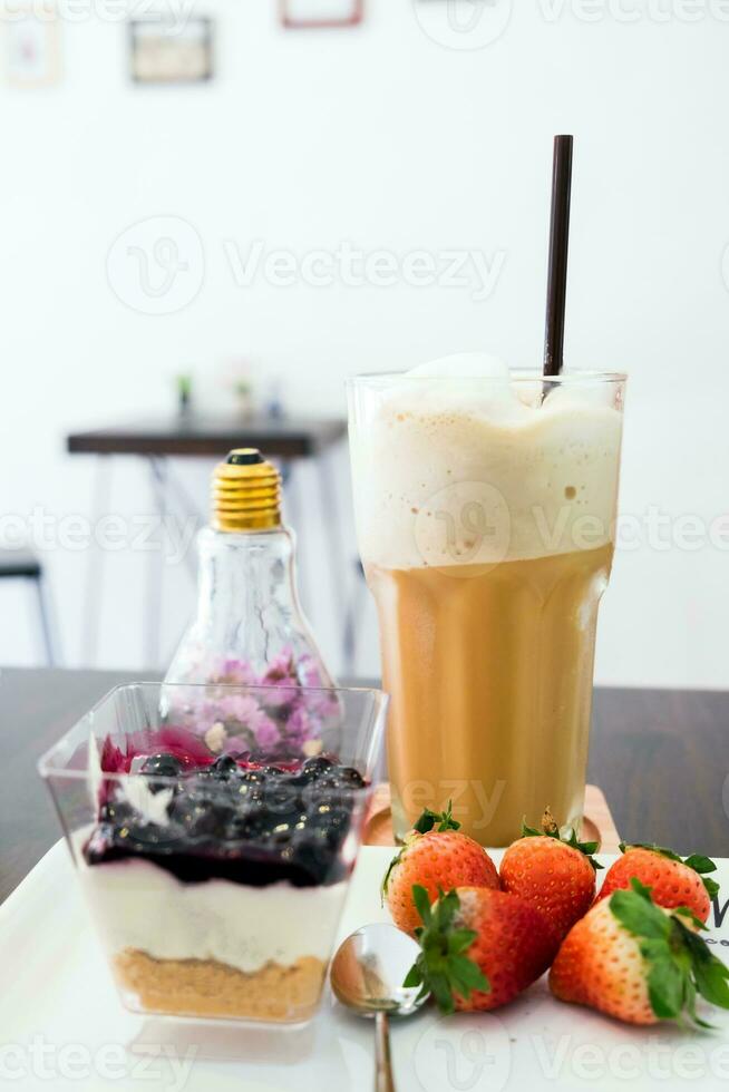 Cappuccino coffee blueberry dessert and strawberry photo