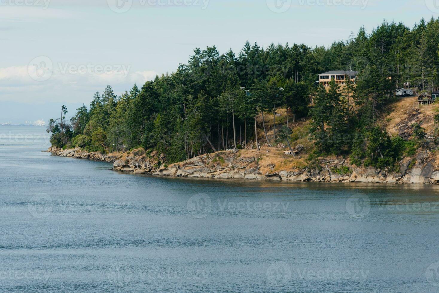 Forst covered island in the Pacific Ocean near Canada photo