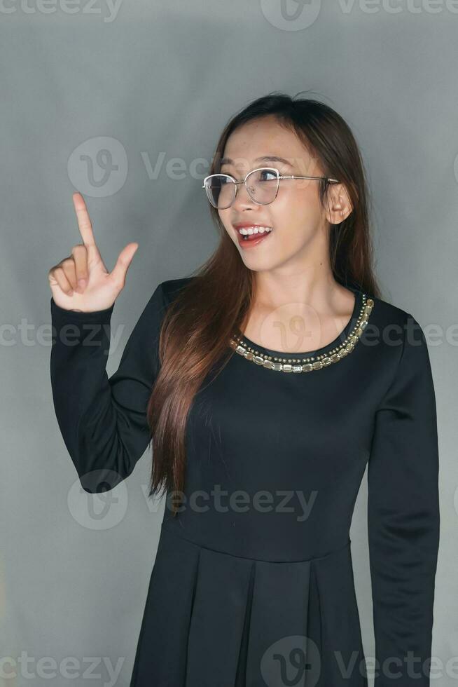 pretty young girl Balinese Asian, Indonesian girl business pose model for advertisement glasses, skincare fashion style photo