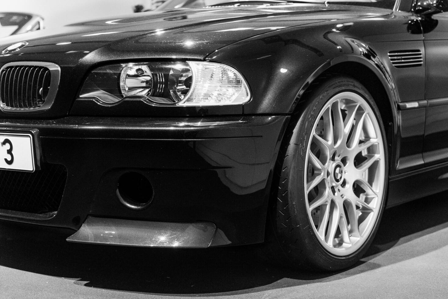 Munich, Germany - Aug 27, 2019 - Black BMW M3 on a close up desaturated shot in BMW museum in Munich photo